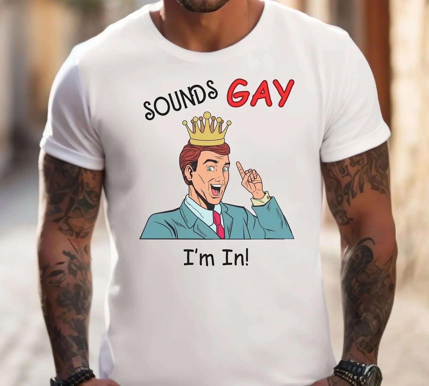 A man wearing a shirt featuring the text 'Sounds Gay I'm In!' celebrating Pride.