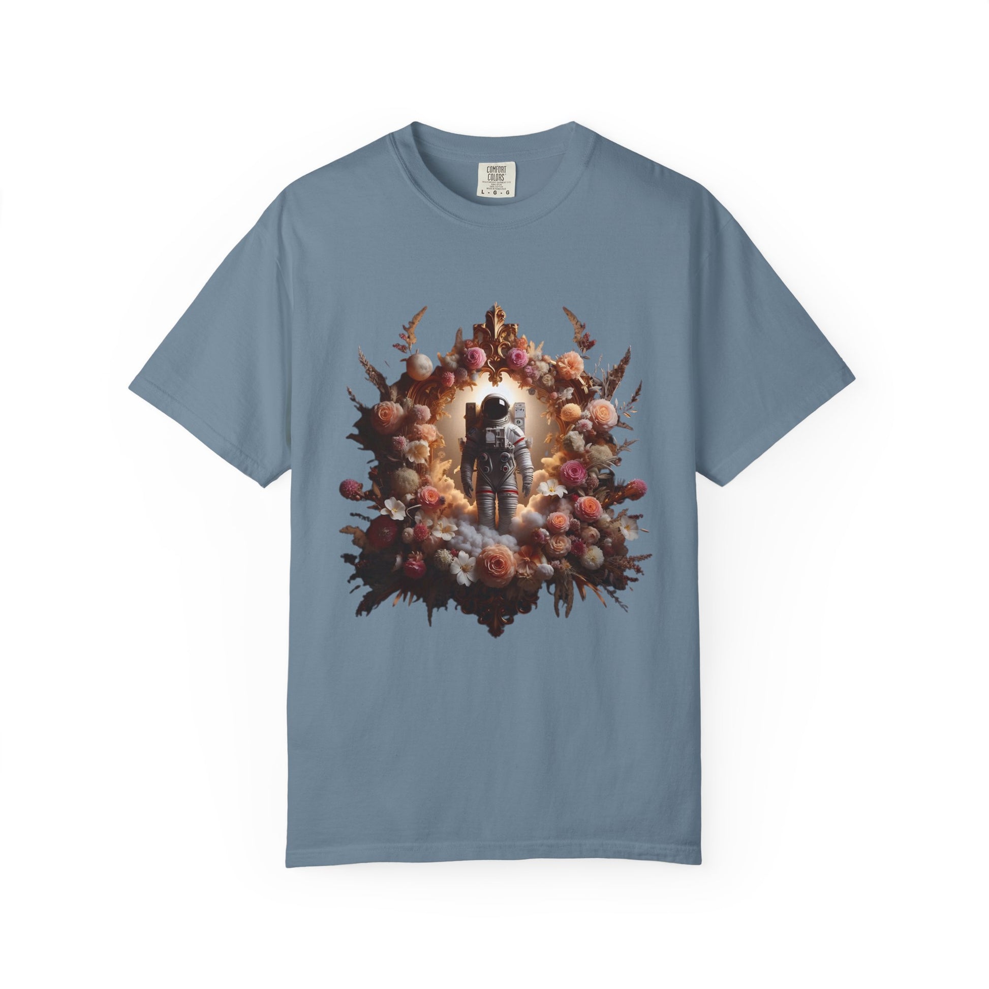 boho astronaut t-shirt featuring an astronaut surrounded by a floral design on a blue shirt.
