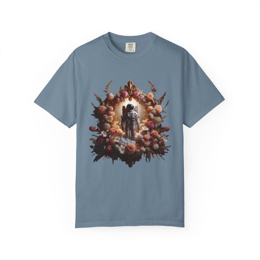 boho astronaut t-shirt featuring an astronaut surrounded by a floral design on a blue shirt.